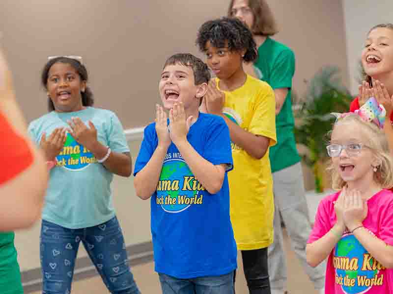 Blue-shirt-11-7 Drama Camps were kids and teens learn and have fun